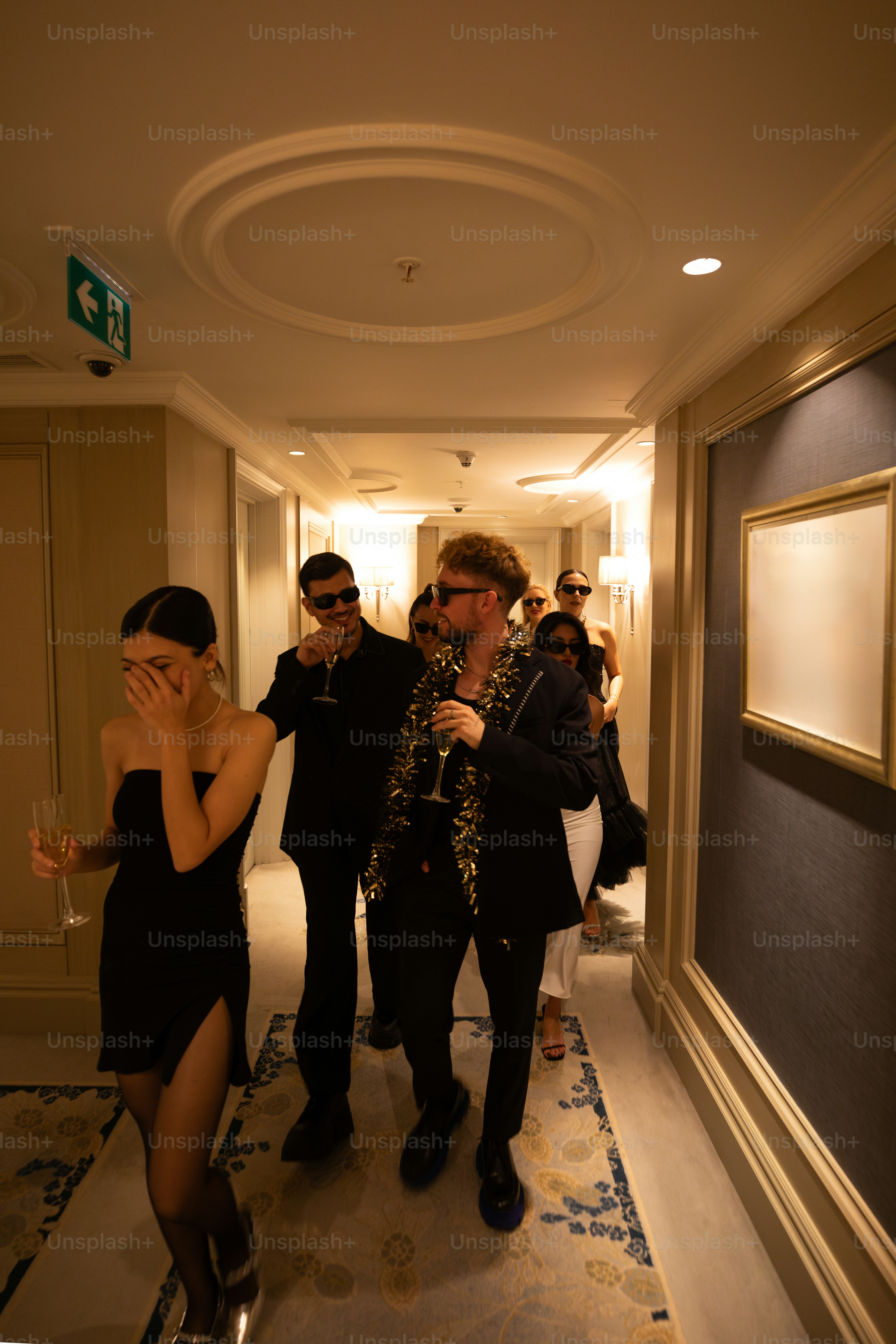 a group of people standing in a hallway
